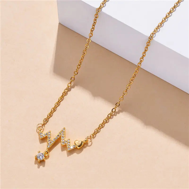 Golden Heartbeat Pendant Necklace