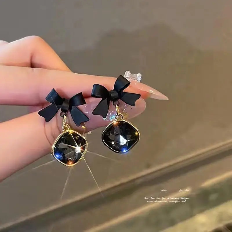 Midnight reflections Bows earrings