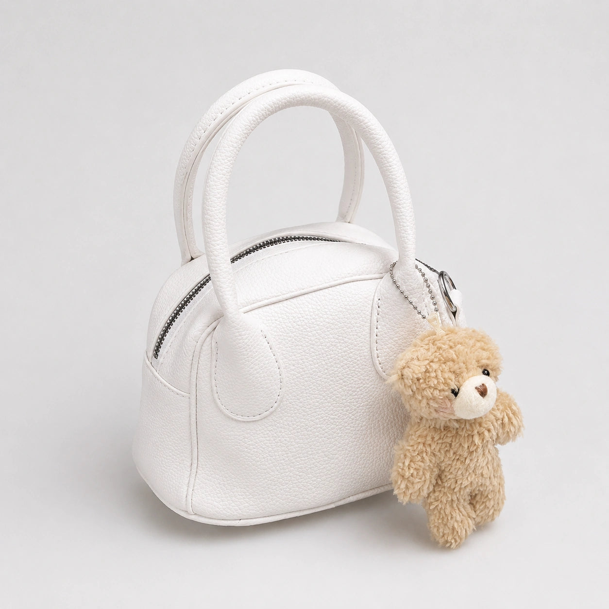 Ivory Charm Hand Bag