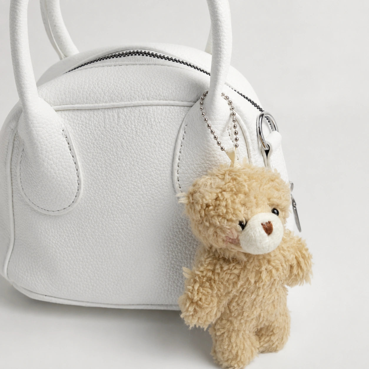 Ivory Charm Hand Bag